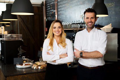 Successful restaurant managers standing together
